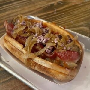 Carm O on a brat at ypsilanti's Wurst Bar